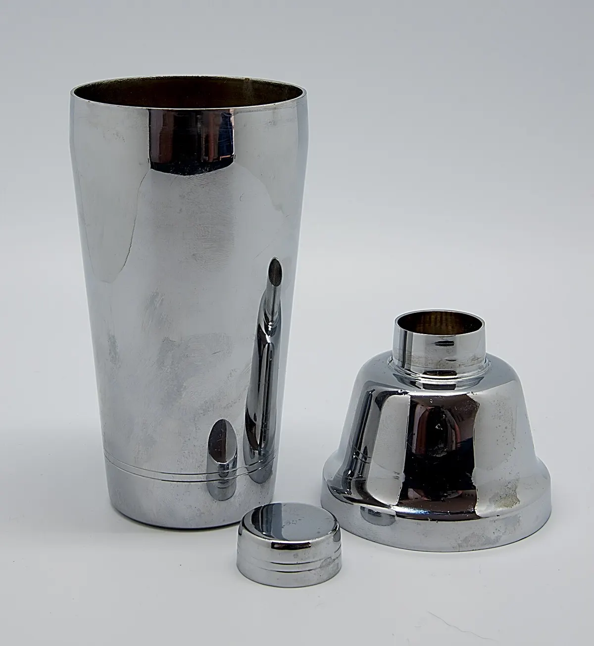 Stainless steel cocktail shaker mid-pour
