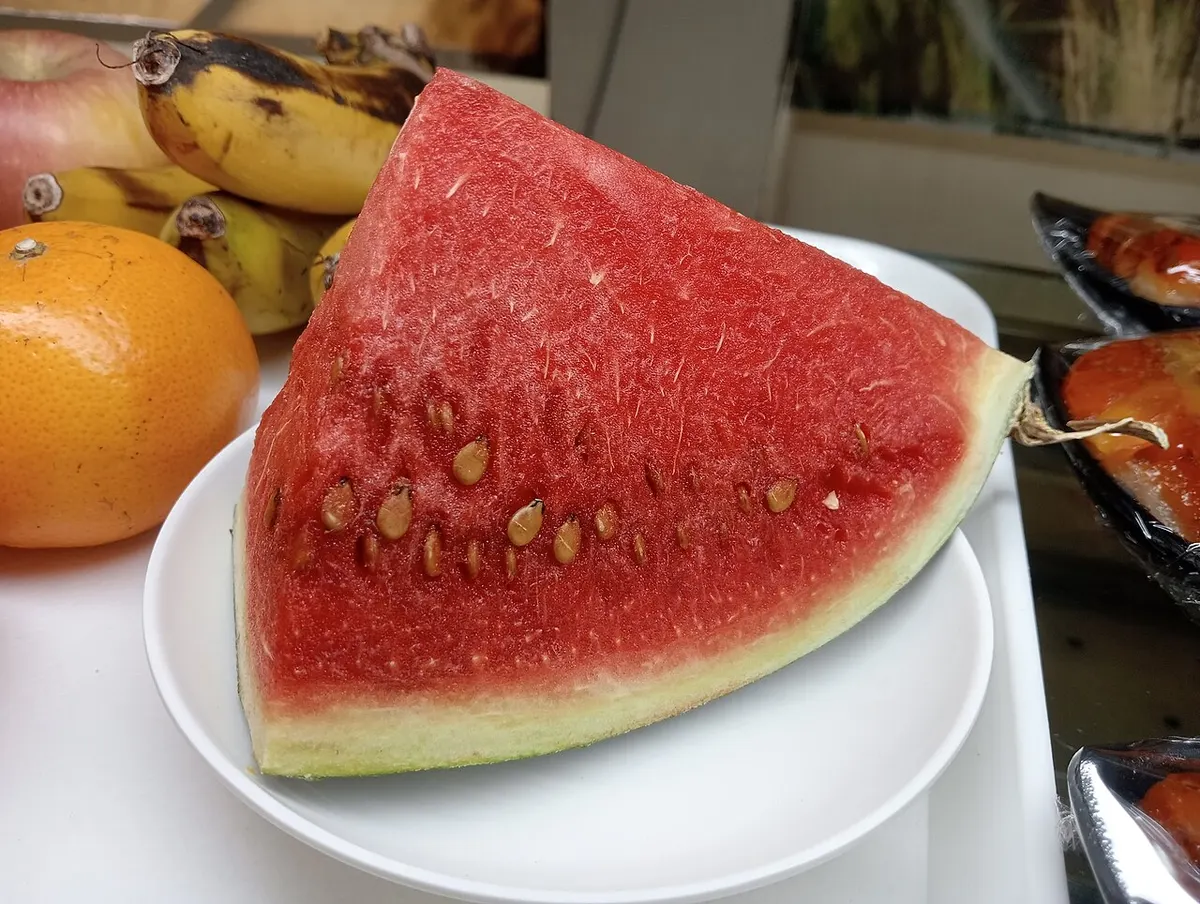 Fresh watermelon wedges on a cutting board