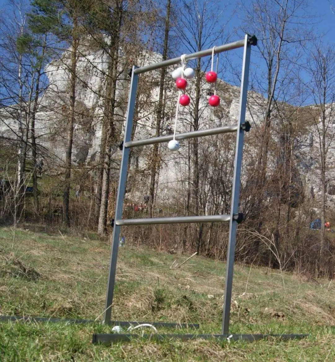Ladder golf ladder set up on a lawn, ready for a round of bola tosses