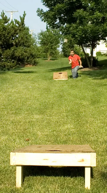 Homemade cornhole boards and bags built from the original Drink101 plans
